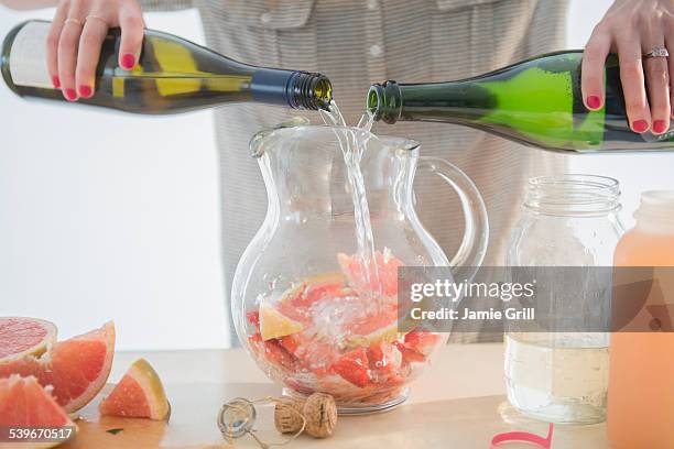 studio shot of fruit cocktail preparation - white sangria glass stock pictures, royalty-free photos & images