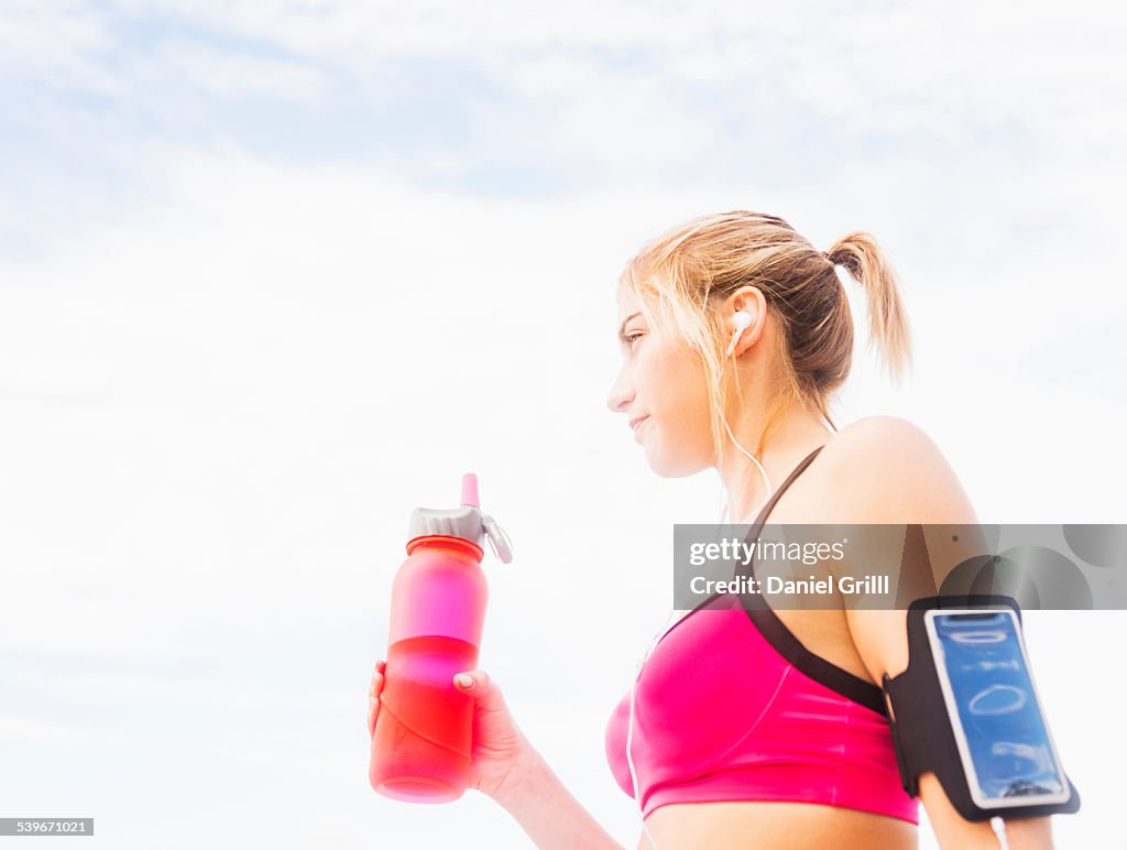 USA, Florida, Jupiter, Woman drinking water from bottle