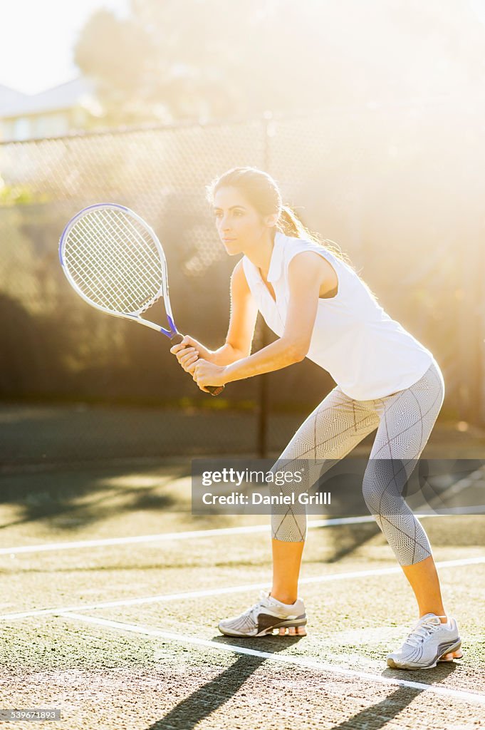 USA, Florida, Jupiter, Portrait of young woman playing tennis in outdoor court