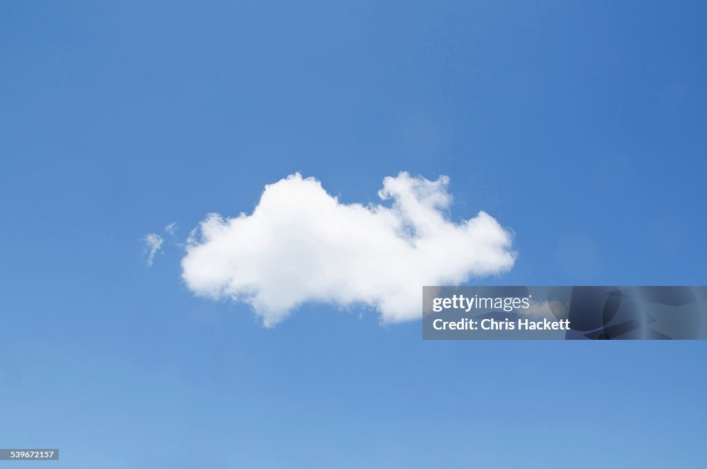 USA, New York, White cumulus cloud in clear blue sky