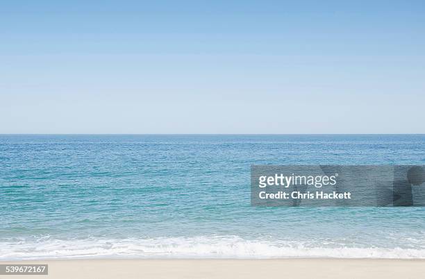 usa, massachusetts, nantucket, seascape with surf on sandy beach - massachusetts beach stock pictures, royalty-free photos & images