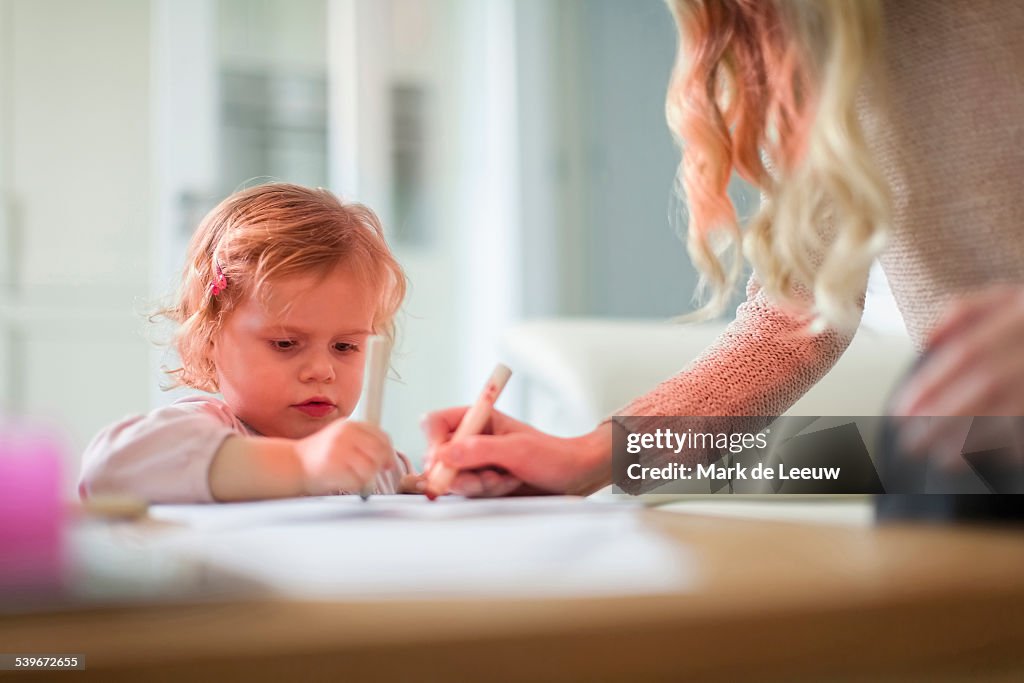 Netherlands, Helvoirt, Mother and daughter(2-3) drawing