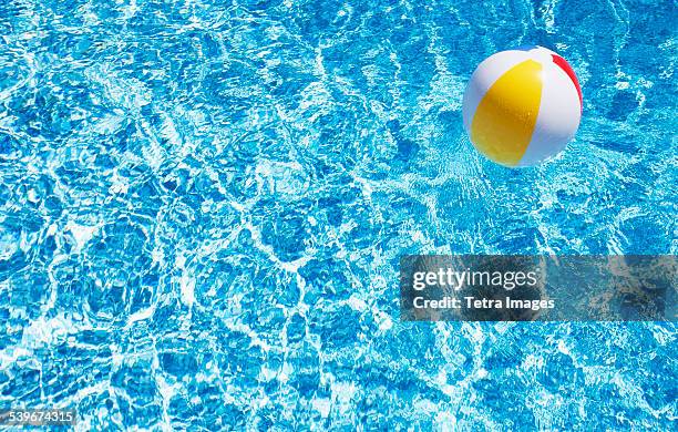 usa, massachusetts, nantucket, beach ball in swimming pool - ゴムボール ストックフォトと画像