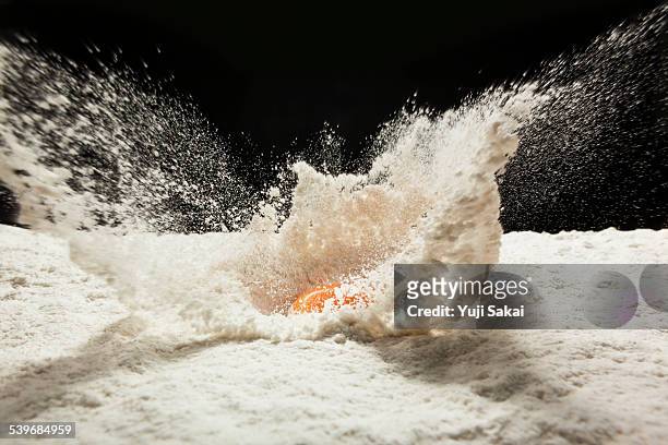 drop egg on wheat flour - flour ストックフォトと画像