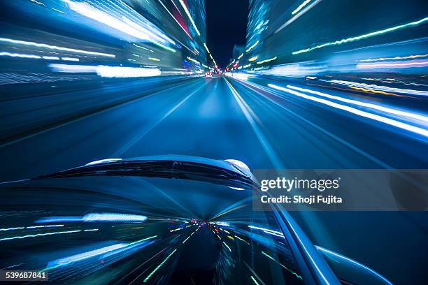 driving city at night. - driving car blue stock pictures, royalty-free photos & images