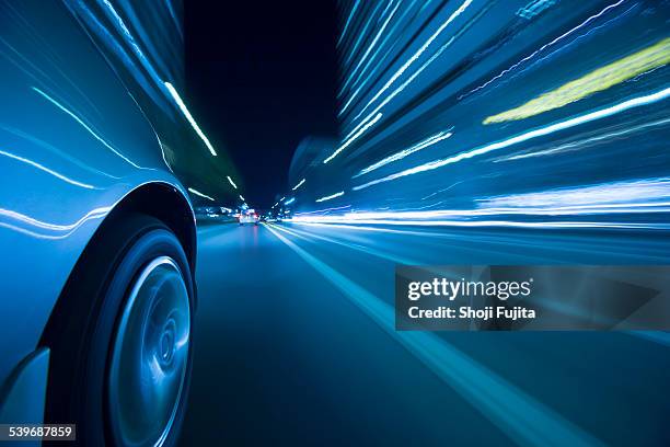 driving city at night. - driving car blue stock pictures, royalty-free photos & images