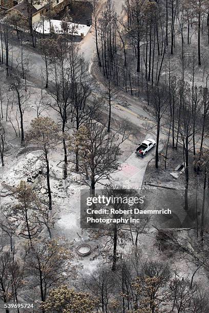 Aerials of fire damage in Bastrop County, TX where wildfires last week claimed 38,000 acres and over 1,500 homes with two deaths reported. The trees...