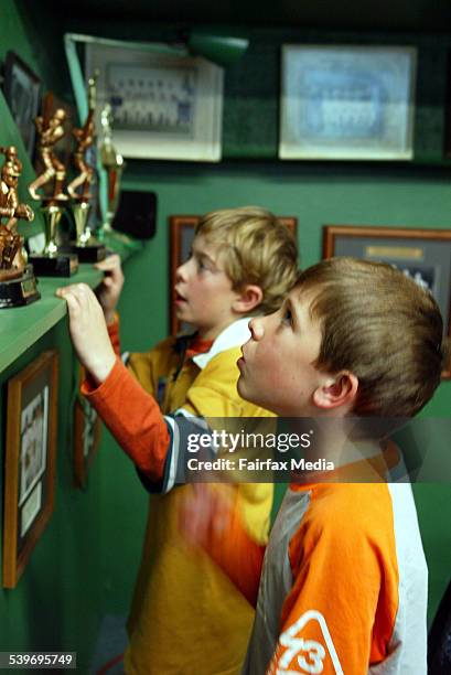 Sam Smyth, in front, and Tom Collins, both 9, at Waverley Oval looking at cricket photos and trophies, 20 August 2005. SHD NEWS Picture by FIONA-LEE...