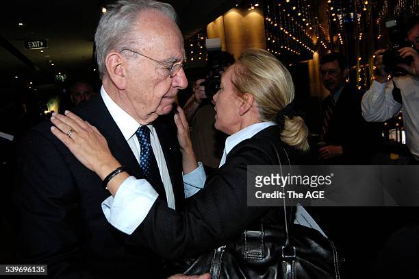 Mr Murdoch embraces his daughter Prudence MacLeod at the News Corp annual general meeting in Adelaide 26 October 2004, THE AGE Picture by DAVID MARIUZ