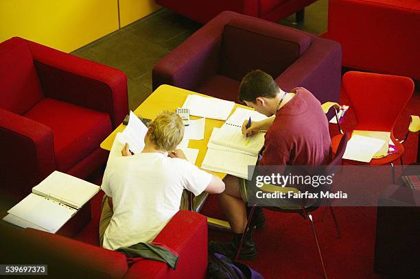 Two university students in a study area, 17 September 2003. AFR Picture by LOUIE DOUVIS