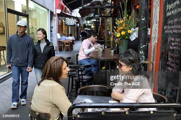Pictured in Block Place laneway off Little Collins at the C&B cafe is Lisa Muccio and Lidia Angilino, 23 August 2004. The AGE Picture by MELANIE...