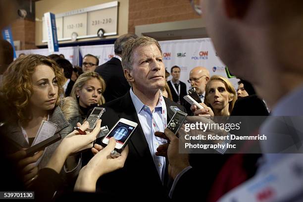 Romney strategist Stuart Stevens speaks to reporters after the as he visits the spin room after the CNN debate in North Charleston on January 19,...