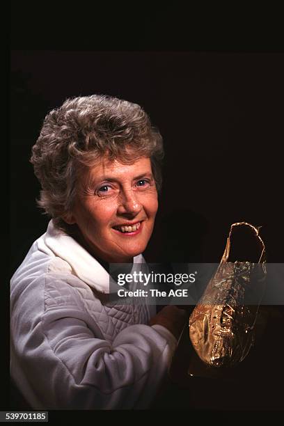 Betty Cuthbert photographed with her golden shoe, 8 October 1994. THE AGE GOOD Picture by BRENDAN READ.