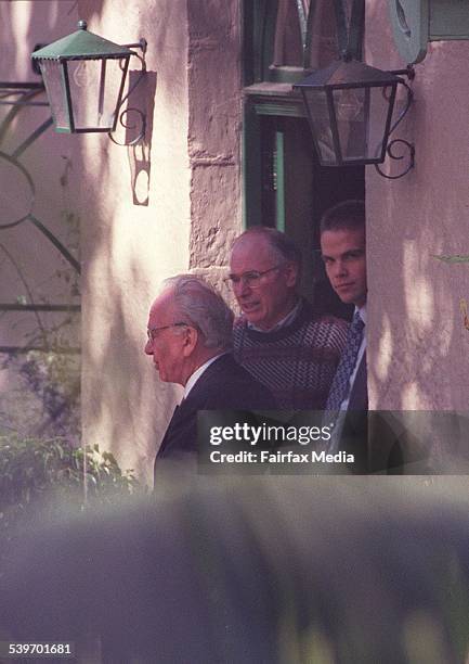 Mr Rupert Murdoch, left, and Mr Lachlan Murdoch are farewelled by Mr Howard after their recent visit to talk about media ownership, 10th August 1997...