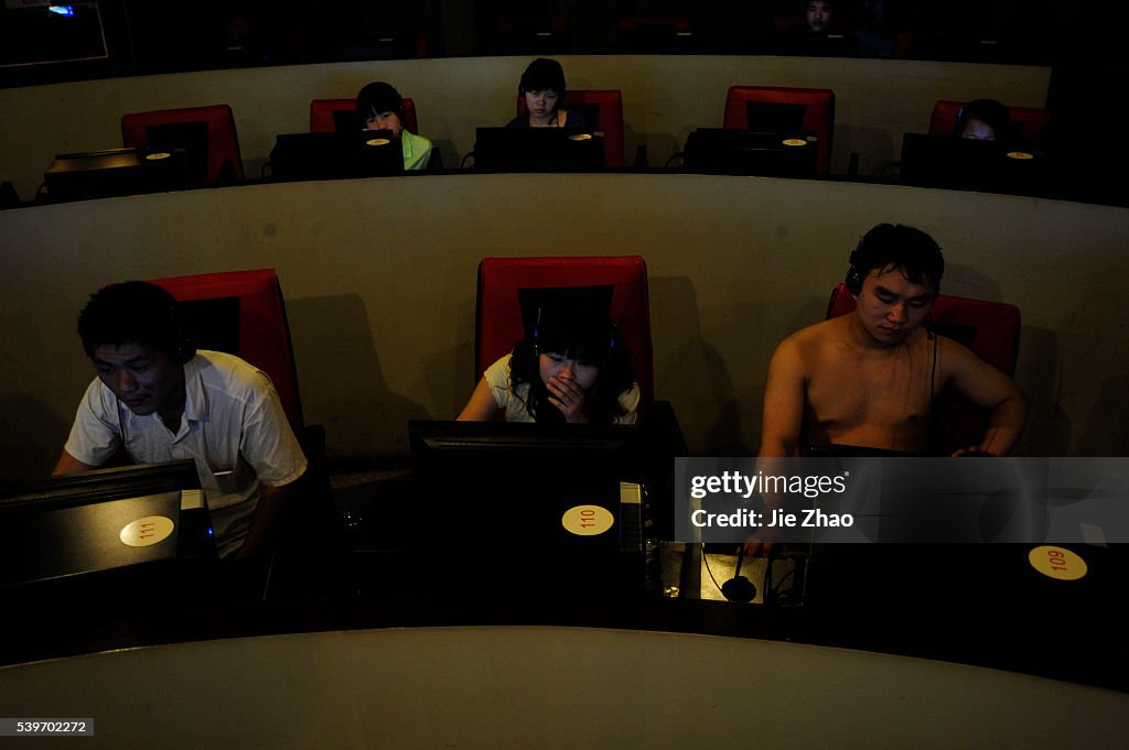 Customers use computers at an internet cafe in Hefei, Anhui province