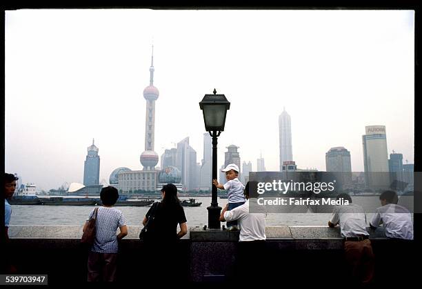 Street scene in Shanghai, China along the Bund overlooking the Pudong Financial District, Shanghai, 15 October 2003. AFR Picture by TAMARA VONINSKI