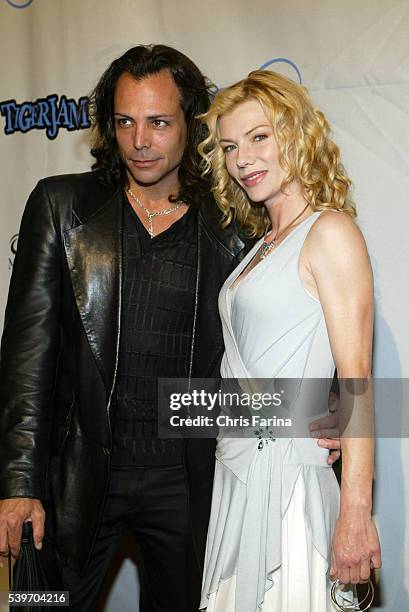 Actor Richard Grieco and actress Stephanie Niznik arrive at the 7th Annual TigerJam at the Mandalay Bay Resort.