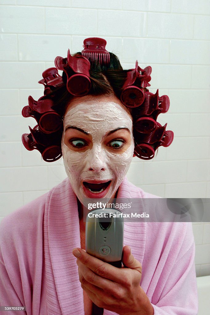 Woman answering Video Phone in the Bathroom, 16 June 2003. SHD Picture by QUENT