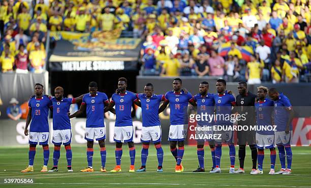 Players of Haiti pay a minute of silence for the victims of an assault on a Florida gay nightclub before the start of their Copa America Centenario...