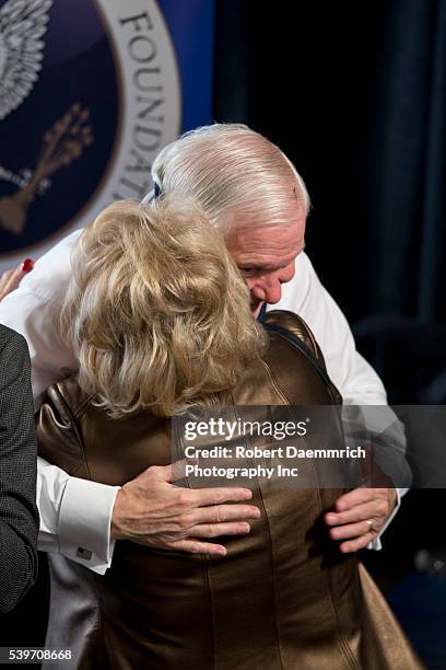 Former Defense Secretary Robert Gates greets a guest after talking about his new book, "Duty" that criticizes many Bush and Obama administration...