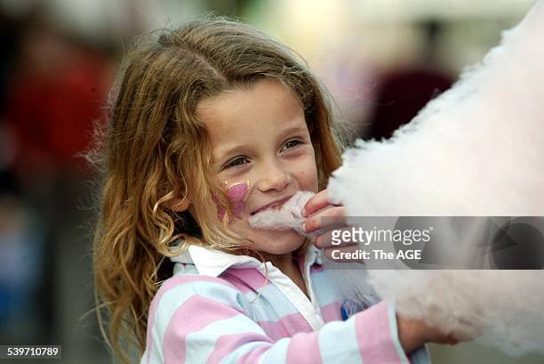 Tucking into fairy floss on a stick at the Royal Melbourne Show, Bree Duncan-Smith from Werribee on 15th September, 2005. THE AGE NEWS Picture by...