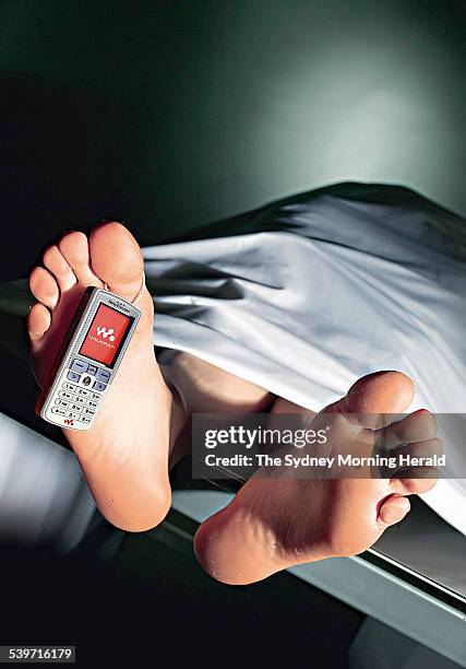 Dead body in the morgue with a mobile phone toe tag, 2 September 2004. SMH Picture by QUENTIN JONES