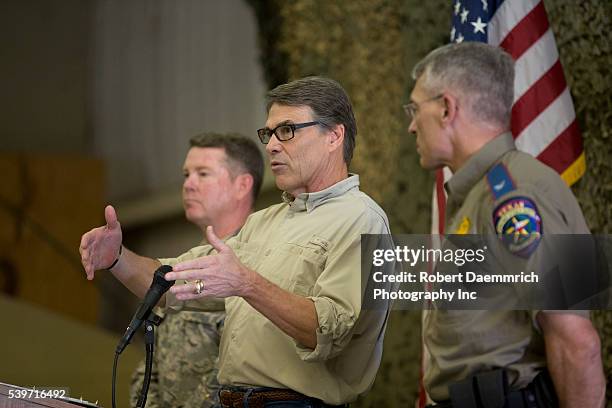 Governor Rick Perry speaks to about a hundred National Guard soldiers as he views Texas Guard operations at Camp Swift east of Austin as troops...