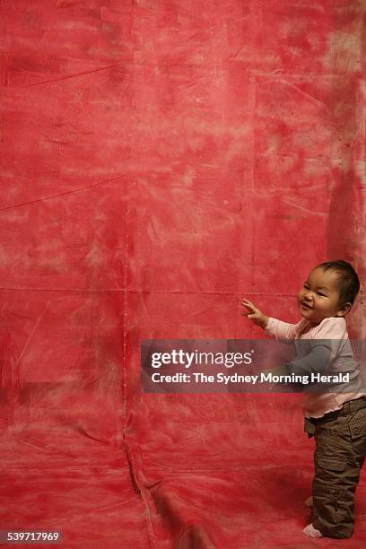 Janine and Michael Kas, with adopted daughter Samantha Xi Biying Kas, 29 September 2005. SMH Picture by STEPHEN BACCON