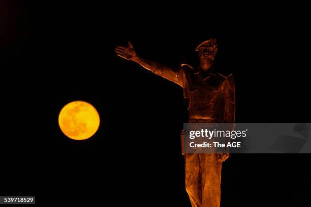 New moon rises over a statue of Saddam Hussein in Baghdad, 18 February 2003 THE AGE Picture by JASON SOUTH