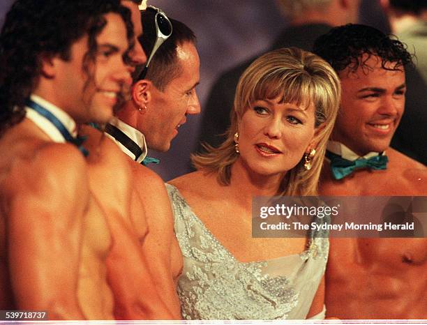 Host Kerri-Anne Kennerley chats to a few shirtless models during the filming of the last Midday Show to go to air, 27 November 1998. SMH Picture by...