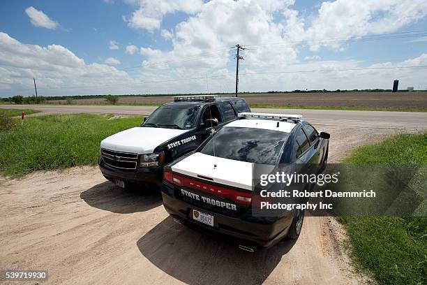 Texas Department of Public Safety troopers patrol along U.S. 281 known at the Military Highway near the Texas-Mexico border. Dozens of DPS officers...