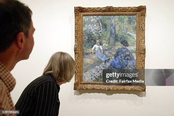 Robert and Adrienne Evans of Gosford examine 'Peasants Resting' at the opening of the Art Gallery of NSW's Pissarro exhibition, 19 November 2005. SHD...