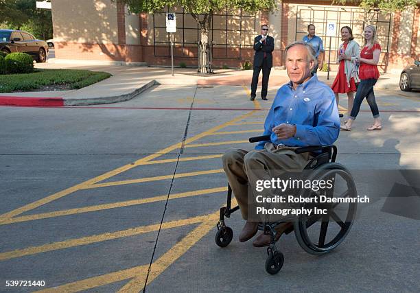 Republican front-runner for Texas governor, Greg Abbott speaks to the press after casting his ballot in early voting ahead of next week's election....