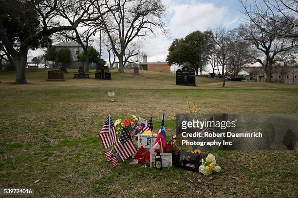 Memorabilia adorns the Texas State Cemetery grave of U.S. Navy Seal sniper Chris Kyle near the Texas State Capitol. Kyle, the most prolific sniper in...