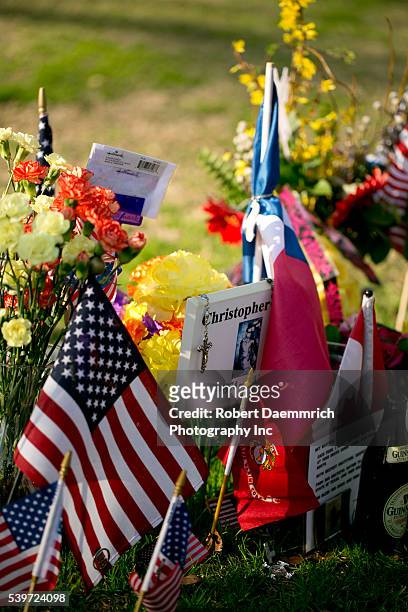 Memorabilia adorns the Texas State Cemetery grave of U.S. Navy Seal sniper Chris Kyle near the Texas State Capitol. Kyle, the most prolific sniper in...