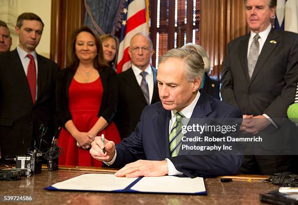 February 2nd, 2015 Austin, Texas USA: Texas Governor Greg Abbott signs proclamation declaring February 2nd, 2015 is to be Chris Kyle Day. Chris Kyle,...