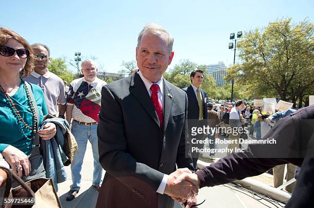 Controversial Alabama Supreme Court Chief Justice Roy Moore shakes hands after speaking at a rally of conservative Texas legislators opposing gay...