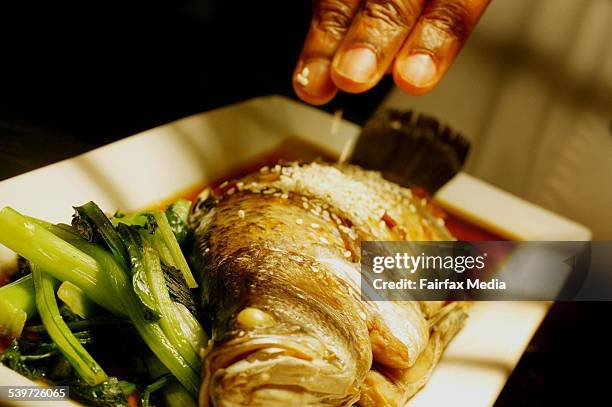 Deep Blue Bistro, Coogee. Whole Baked Baby Barramundi with Asian Greens and Soy Ginger Reduction, 19 July 2005. SHD Picture by FIONA-LEE QUIMBY