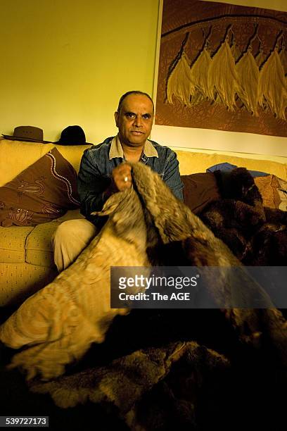 Pastor Doug Nicholls' grandson Gary Murray photographed with a possum skin coat, on 15 February 2006. THE AGE NEWS Picture by JOHN DONEGAN