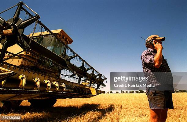 Farmer talks on a mobile phone on a farm near Deniliquin in New South Wales, 12 January 2000 AFR Picture by VIRGINIA STAR