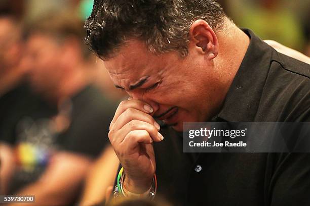 Orlando who was injured in the mass shooting at the Pulse Nightclub cries as he attends a memorial service at the Joy MCC Church for the victims of...