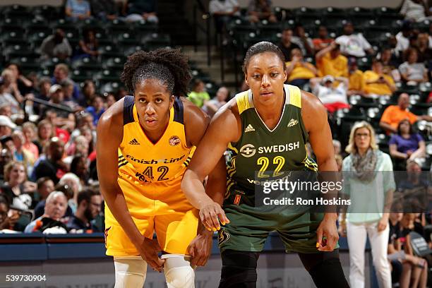 Shenise Johnson of the Indiana Fever fights for the position against Monica Wright of the Seattle Storm during the game on June 12, 2016 at Bankers...