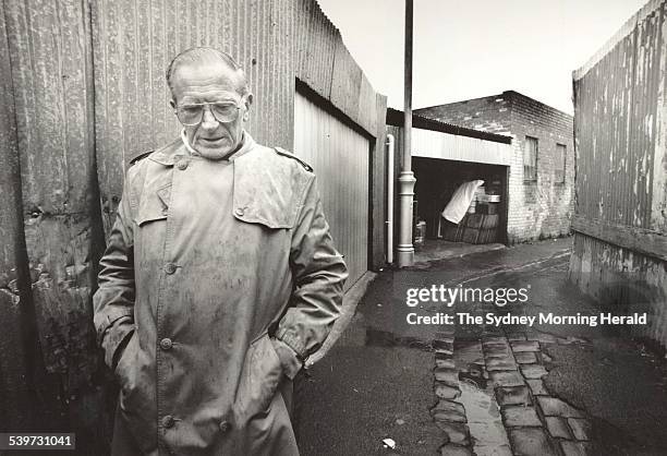 Author Frank Hardy, in a lane off Johnston Street, Collingwood, which he describes in his book 'Power Without Glory' as the site of the totalisator...