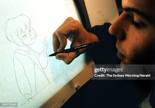 Tristan Balo, a trainee working on the Peter Pan animation project, works on an illustration, 3 August 2000. SMH Picture by EDWINA PICKLES