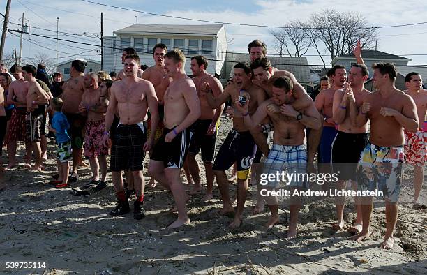 In order to raise money for victims of Hurricane Sandy, friends and neighbors in the Rockaways sponsored swimmers to jump into the freezing bay...