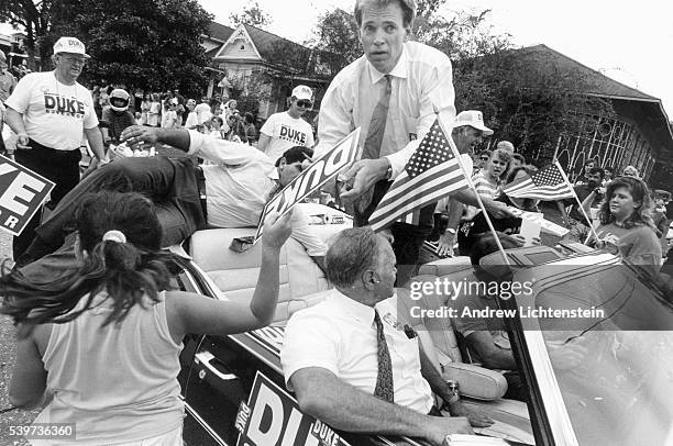 David Duke's bodyguard reaches for a gun as Duke's motorcade approaches a part of town where mostly African Americans live. David Duke, a former Klu...