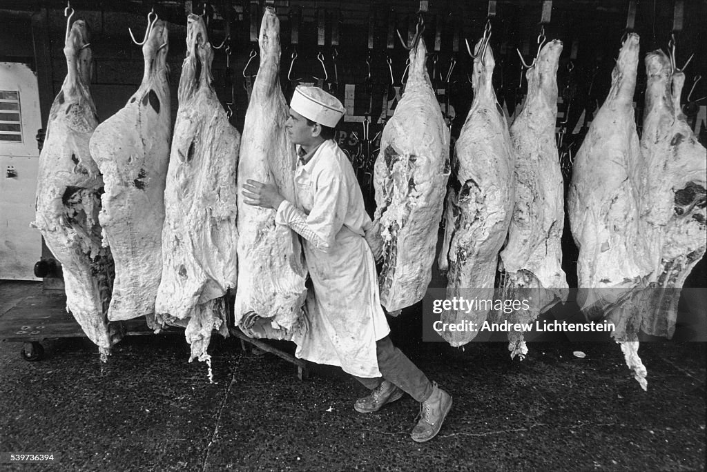 Meat Packing District Worker and Carcasses