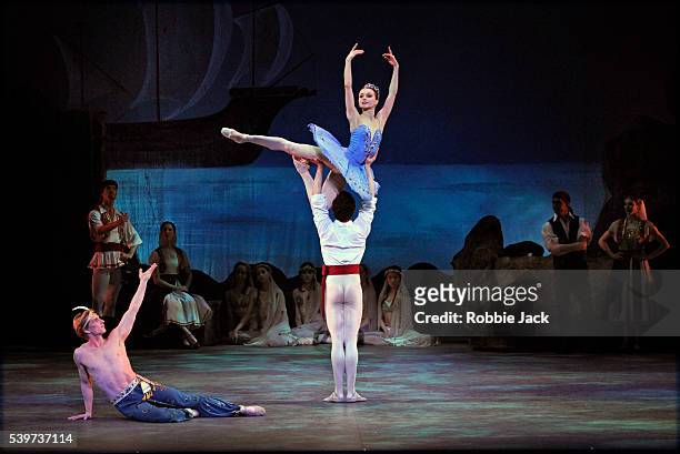 Irina Dvorovenko as Medora,Cory Stearns as Conrad and Ethan Stiefel as Ali with artists of the company in American Ballet Theatre's production of "Le...