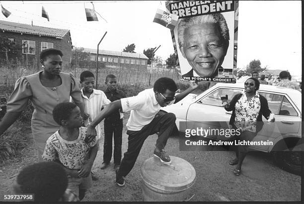 Township residents celebrate African National Congress candidate Nelson Mandela's historic election as President of the New South Africa. It is the...