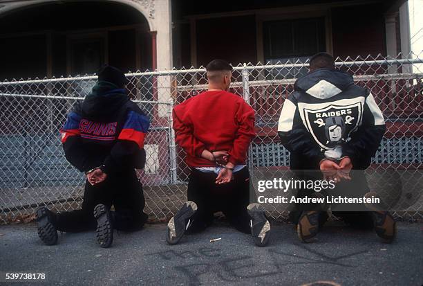 Youths suspected of street dealing are lined up to be searched before being transferred to the jail. In the mid-1990s, East Bridgeport became a...